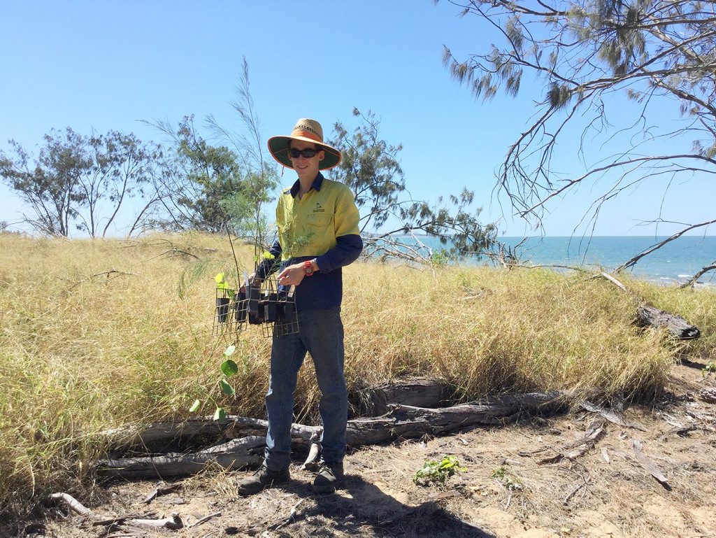 REPAIR WORK: Council's Lewis Heuvel is part of the project team planting new trees along the Tannum Sands foreshore. REPAIR WORK: Council's Lewis Heuvel is part of the project team planting new trees along the Tannum Sands foreshore.
