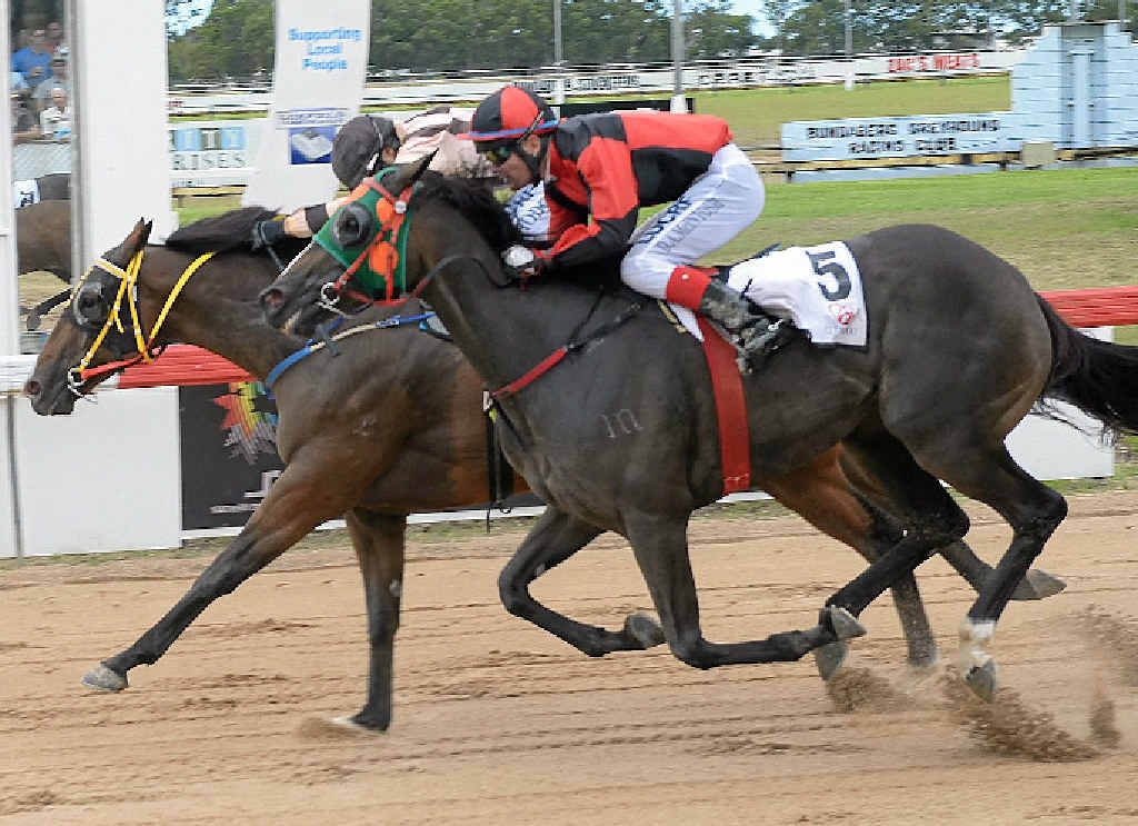 BY A NOSE: Jed Hodge and Redwin ahead of Damion McIntosh on Way Up There at the Catholic Schools Race Day at Thabeban Park. A protest from McIntosh was dismissed by stewards. BY A NOSE: Jed Hodge and Redwin ahead of Damion McIntosh on Way Up There at the Catholic Schools Race Day at Thabeban Park. A protest from McIntosh was dismissed by stewards.