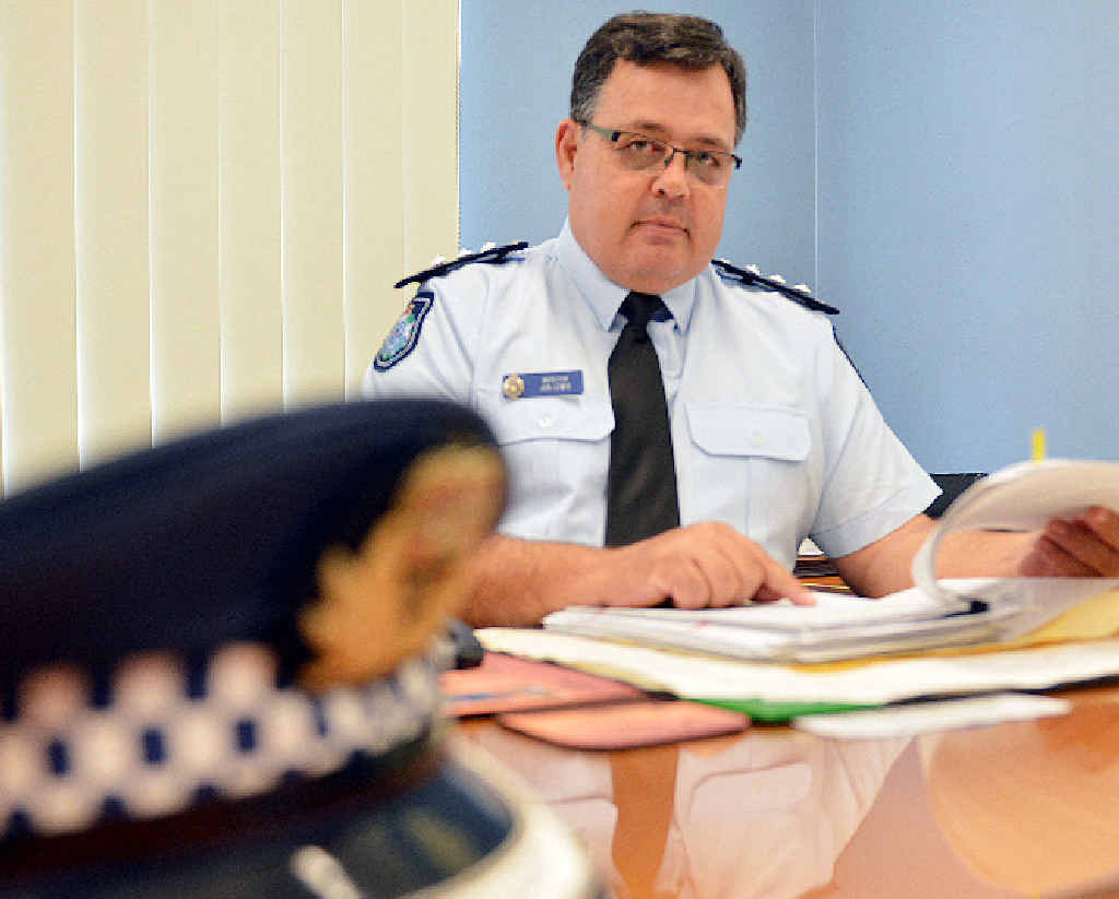 STOP DOMESTIC VIOLENCE: Inspector Jon Lewis looks over case files in his office yesterday. STOP DOMESTIC VIOLENCE: Inspector Jon Lewis looks over case files in his office yesterday.