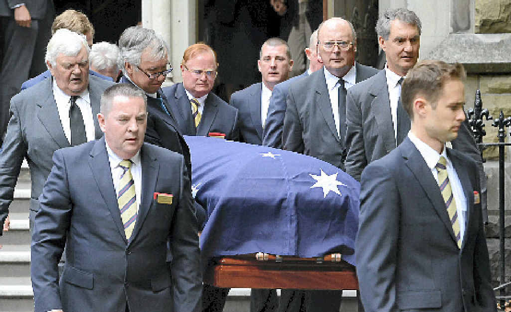 Malcolm Fraser’s coffin is carried from the church yesterday. At top right his wife Tamie is consoled and below a group of Vietnamese migrants pays tribute. Malcolm Fraser’s coffin is carried from the church yesterday. At top right his wife Tamie is consoled and below a group of Vietnamese migrants pays tribute.