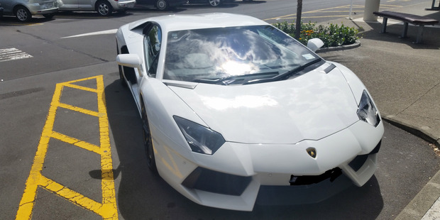 The supercar, worth more than $400,000, would later be towed. It is not the first time its owner has parked illegally at the shopping centre. The supercar, worth more than $400,000, would later be towed. It is not the first time its owner has parked illegally at the shopping centre.