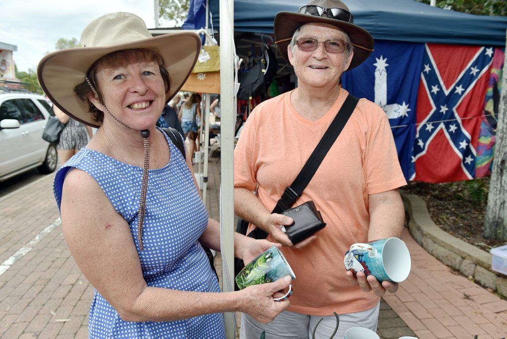 Image for sale: Torquay Esplanade markets - Quirky - Jan Schwerin and Heather Pitt found some hand painted mugs. Photo: Valerie Horton / Fraser Coast Chronicle