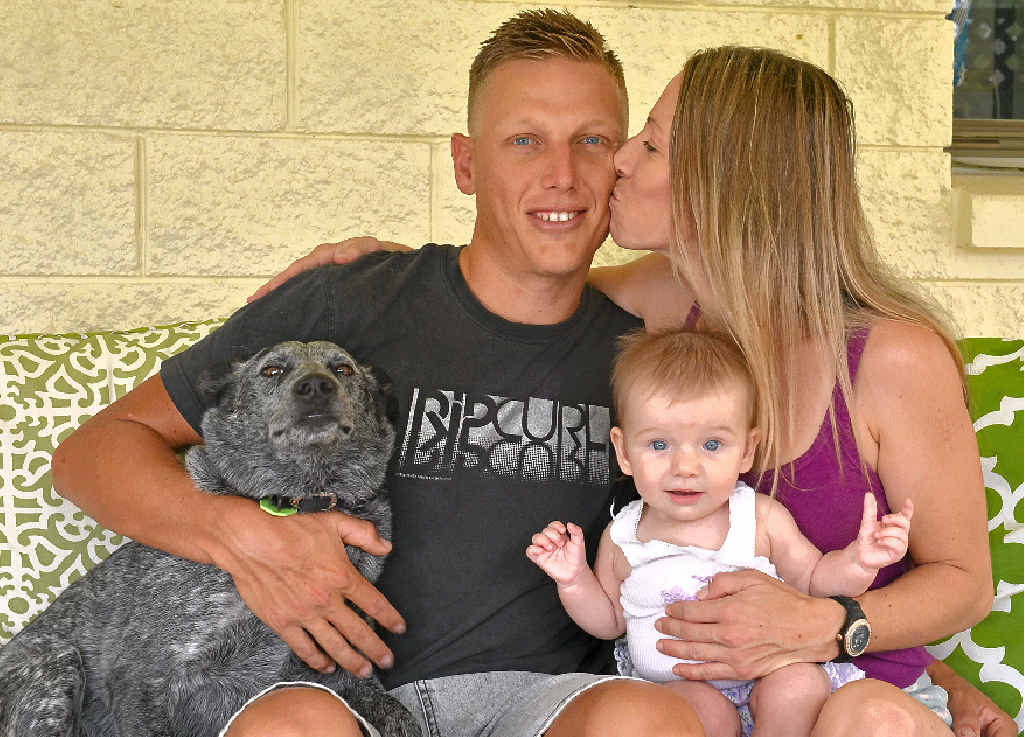 MY HERO: David Ferris, pictured with partner Carrie Jeffery, daugher Ruby Ferris and dog Toby, will be given a bravery award for helping rescue two men trapped in a burning car. MY HERO: David Ferris, pictured with partner Carrie Jeffery, daugher Ruby Ferris and dog Toby, will be given a bravery award for helping rescue two men trapped in a burning car.