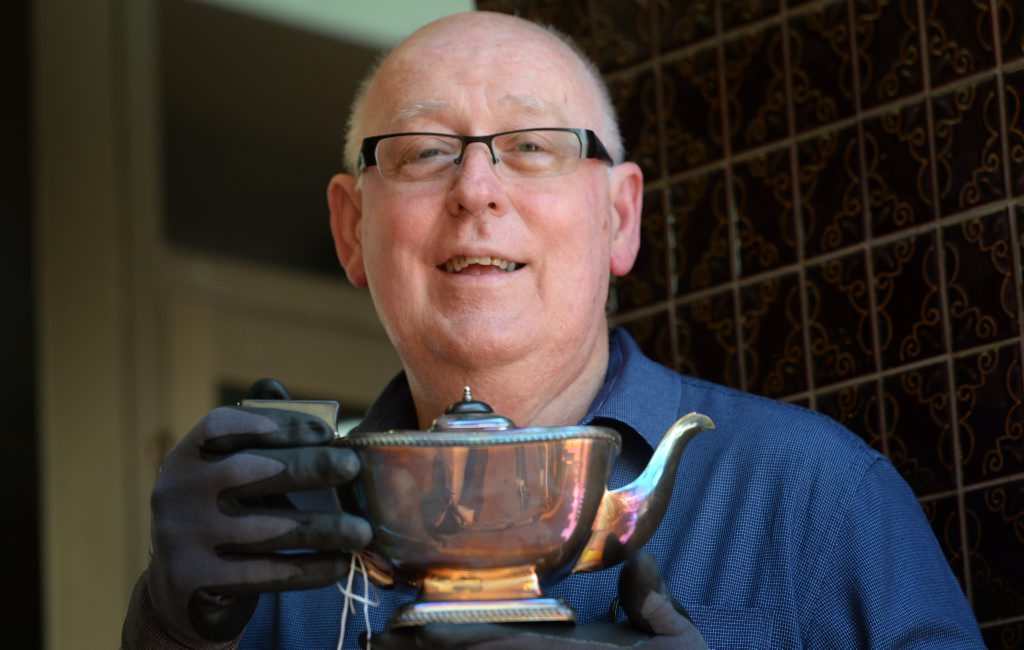 President of the Friends of Rockhampton Art Gallery Rob Hughes with an antique silver teapot. The Friends are holding an Antique and Collectables Valuation Day where Melbourne based valuer and auctioneer Warren Joel will be on hand. Photo: Chris Ison / The Morning Bulletin President of the Friends of Rockhampton Art Gallery Rob Hughes with an antique silver teapot. The Friends are holding an Antique and Collectables Valuation Day where Melbourne based valuer and auctioneer Warren Joel will be on hand. Photo: Chris Ison / The Morning Bulletin