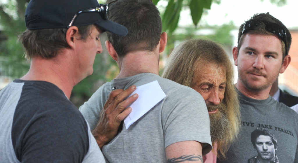 John Edwards is comforted by his sons after they spoke to the media in Grafton yesterday. Police said at the press conference they believe Sharon Edwards was in the Lawrence area early on March 15. John Edwards is comforted by his sons after they spoke to the media in Grafton yesterday. Police said at the press conference they believe Sharon Edwards was in the Lawrence area early on March 15.