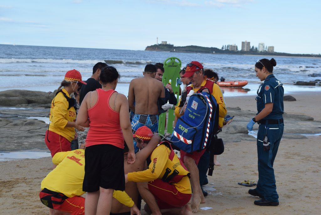 EMERGENCY crews and surf life savers carry the man involved in a near drowning at Mooloolaba into the awaiting ambulance. Photo: Roxanne McKarty-OKane / Sunshine Coast Daily EMERGENCY crews and surf life savers carry the man involved in a near drowning at Mooloolaba into the awaiting ambulance. Photo: Roxanne McKarty-OKane / Sunshine Coast Daily