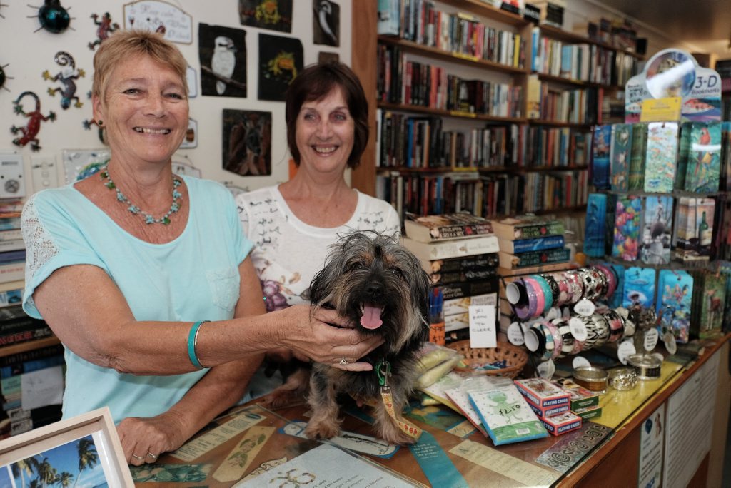 GRAND ADVENTURE: 'Bundy' the Yorkshire Terrier with Lea's Book Exchange owner Lea Payne and assistant Wendy Galloway. 'Bundy' hitch-hiked her way from Bundaberg to Airlie Beach, where she was dropped off by a group of German backpackers at the book store. Photo Matthew Newton / The Guardian GRAND ADVENTURE: 'Bundy' the Yorkshire Terrier with Lea's Book Exchange owner Lea Payne and assistant Wendy Galloway. 'Bundy' hitch-hiked her way from Bundaberg to Airlie Beach, where she was dropped off by a group of German backpackers at the book store. Photo Matthew Newton / The Guardian