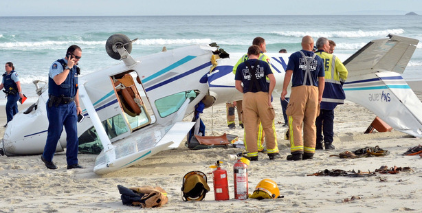 Emergency services with a light plane that flipped while making a forced landing on Tomahawk Beach yesterday. Emergency services with a light plane that flipped while making a forced landing on Tomahawk Beach yesterday.