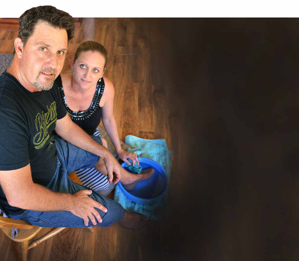 Jason Austin of The Palms being attended by his wife Anne after being speared in the inside of his left foot by a stingray whilst fishing at Tinnanbar, Great Sandy Strait over the Easter holiday. PHOTO: GREG MILLER Jason Austin of The Palms being attended by his wife Anne after being speared in the inside of his left foot by a stingray whilst fishing at Tinnanbar, Great Sandy Strait over the Easter holiday. PHOTO: GREG MILLER