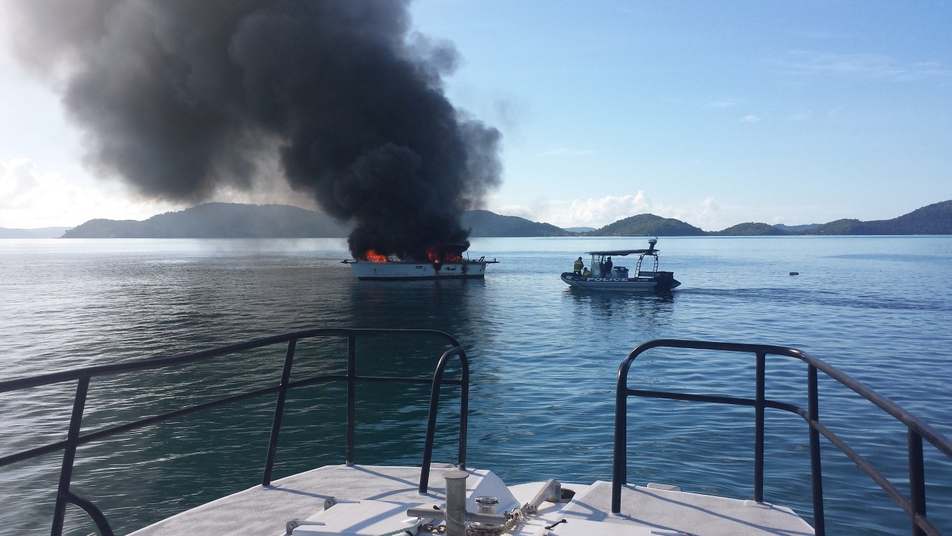 Boat fire out from Shute Harbour. Boat fire out from Shute Harbour.