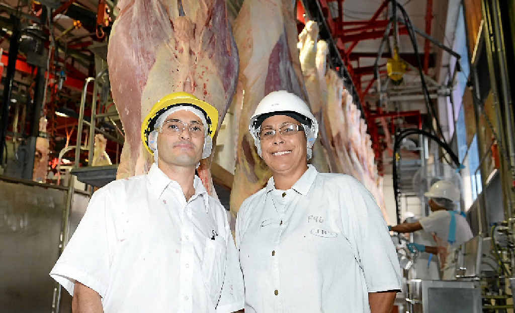 GLAD TO BE BACK: JBS employees Reginaldo Elias and Lee Dodd are relieved to be back at work this week after a seven-week break following Cyclone Marcia. GLAD TO BE BACK: JBS employees Reginaldo Elias and Lee Dodd are relieved to be back at work this week after a seven-week break following Cyclone Marcia.