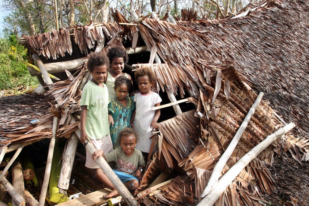 Children play in the collasped roof of their preschool at Karngo. Vanuatu aftermath from Cyclone Pam. Photo Vicki Wood / Caboolture News Children play in the collasped roof of their preschool at Karngo. Vanuatu aftermath from Cyclone Pam. Photo Vicki Wood / Caboolture News