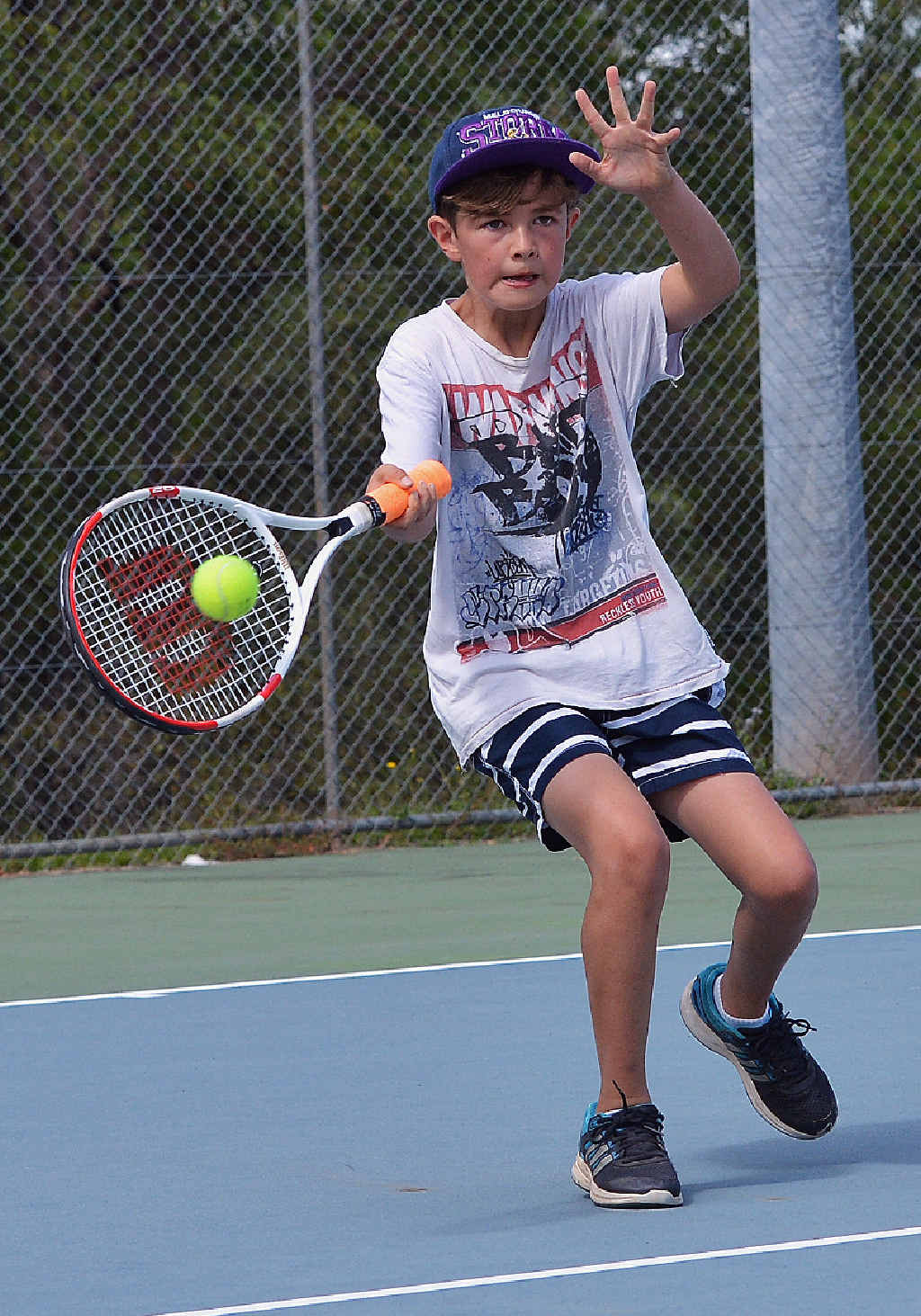STRETCH: Mitchell Izett, 11, lines up a forehand in his 4/3 win over Joseph Milgate. STRETCH: Mitchell Izett, 11, lines up a forehand in his 4/3 win over Joseph Milgate.