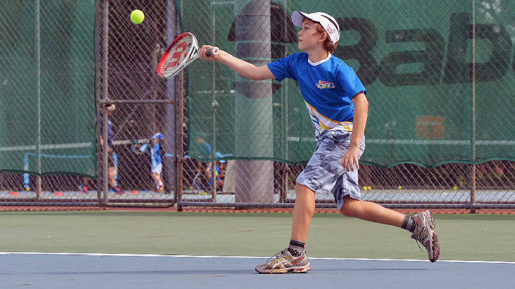 EYE ON THE BALL: Joseph Milgate, 10 (above), reaches for a forehand in his 4/3 win over Mitchell Izett in the Holiday Fun Tennis Tournament at the Reg English Memorial Tennis Centre. EYE ON THE BALL: Joseph Milgate, 10 (above), reaches for a forehand in his 4/3 win over Mitchell Izett in the Holiday Fun Tennis Tournament at the Reg English Memorial Tennis Centre.