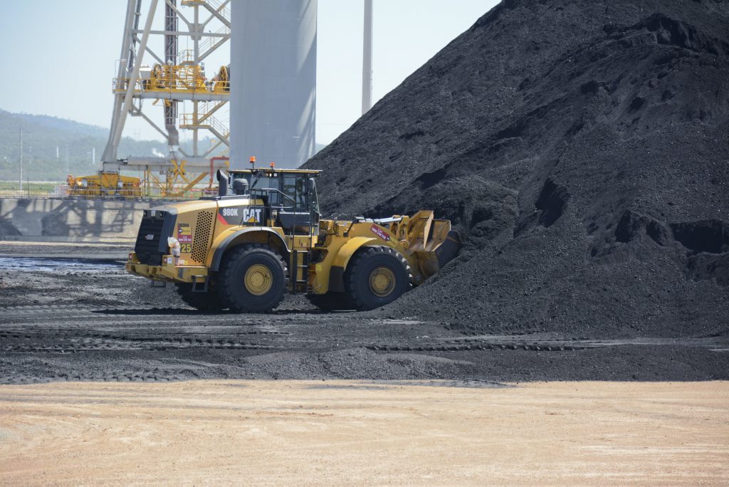 A week after the first load of coal arrives at the Wiggins Island Coal Export Terminal, dozers and trucks begin to move the coal to bed down the stockyard. A week after the first load of coal arrives at the Wiggins Island Coal Export Terminal, dozers and trucks begin to move the coal to bed down the stockyard.