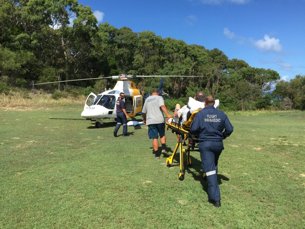 A Scottish tourist is wheeled to the RACQ Careflight Rescue helicopter after suffering a fall on Fraser Island. A Scottish tourist is wheeled to the RACQ Careflight Rescue helicopter after suffering a fall on Fraser Island.
