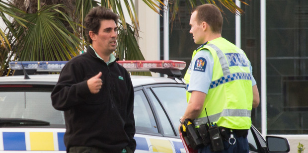 Former Black Cap Mathew Sinclair speaks to a police officer outside McDonalds in Taradale after a domestic incident. Former Black Cap Mathew Sinclair speaks to a police officer outside McDonalds in Taradale after a domestic incident.