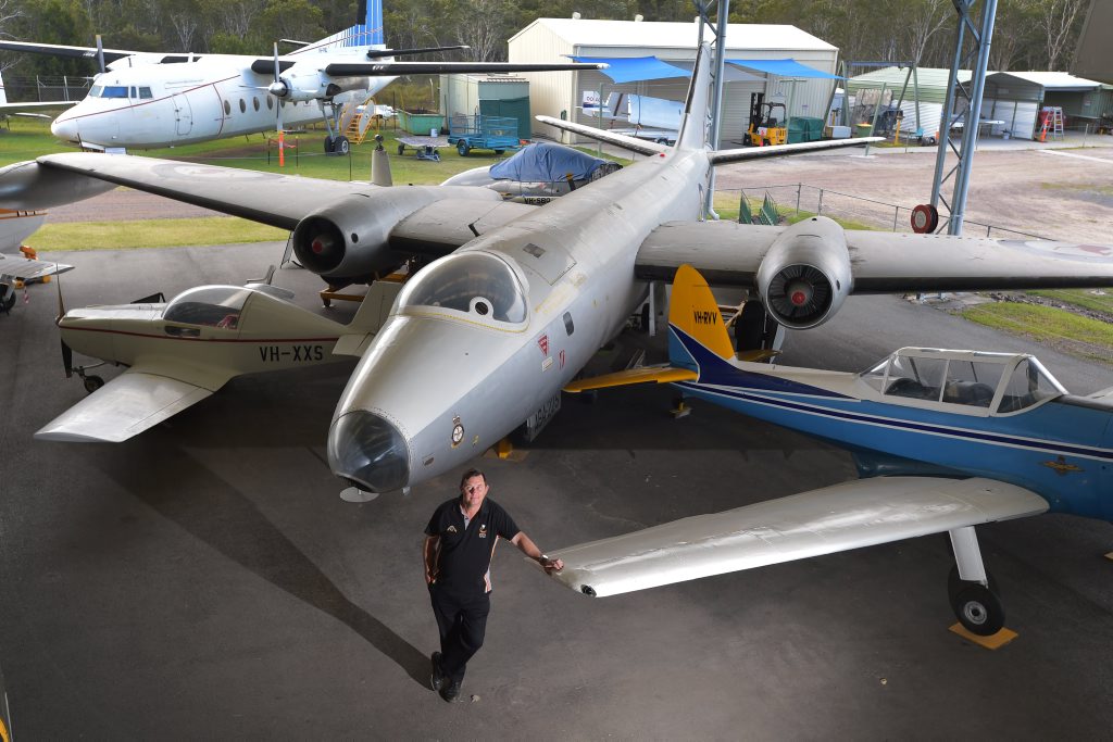 The Queensland Air Museum president, Cameron Elmes, with a Canberra Bomber. The Queensland Air Museum president, Cameron Elmes, with a Canberra Bomber.