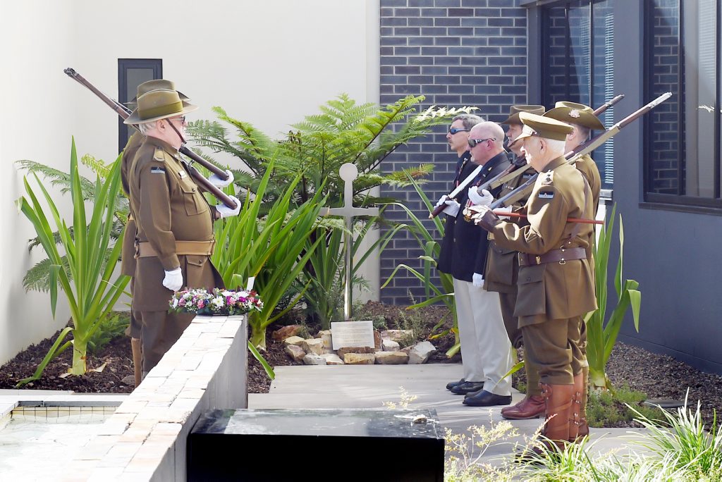 The 9th Battalion re-enactment group stood at attention during the St Stephen's Hospital war memorial dedication service. The 9th Battalion re-enactment group stood at attention during the St Stephen's Hospital war memorial dedication service.