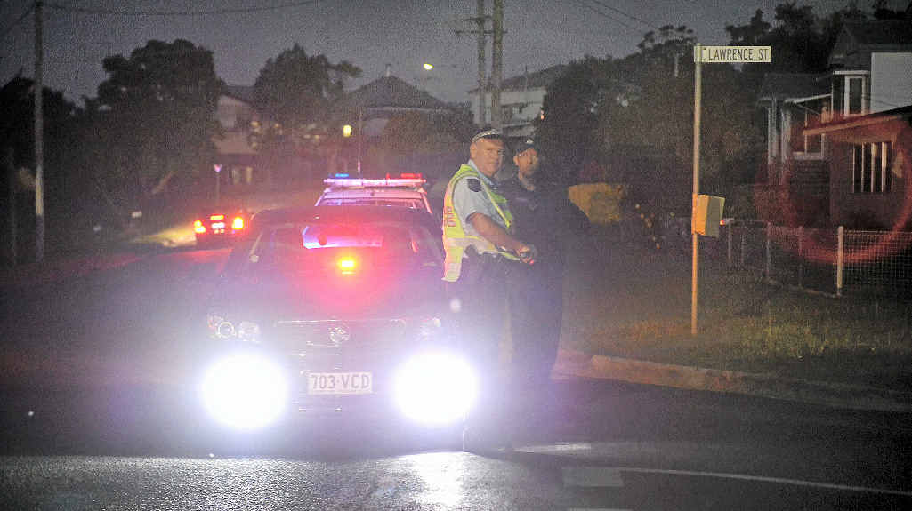 ON GUARD: A police barrier kept civilians away from the potentially lethal action in Lawrence St. ON GUARD: A police barrier kept civilians away from the potentially lethal action in Lawrence St.