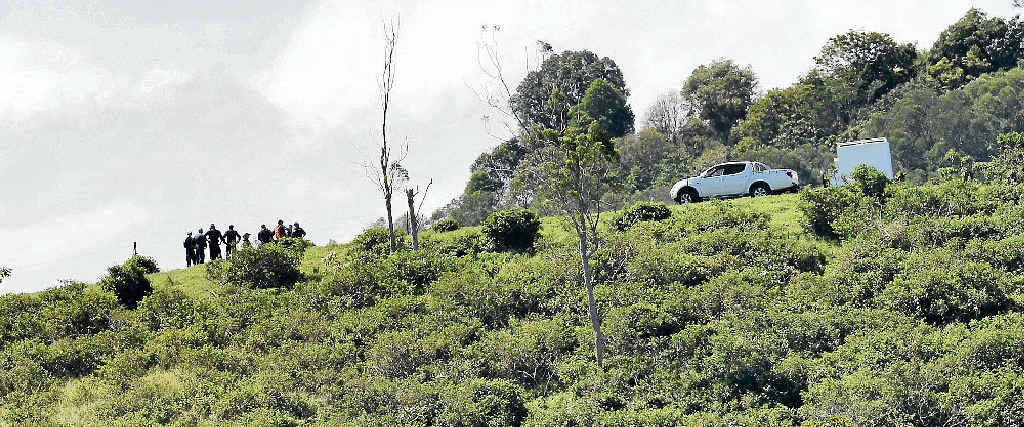 REMOTE SITE: Specially trained police consider their next move, as investigation and recovery efforts continue into the fatal plane crash near Woolooga on Saturday which claimed the life of Yandina pilot Rob Pavan. REMOTE SITE: Specially trained police consider their next move, as investigation and recovery efforts continue into the fatal plane crash near Woolooga on Saturday which claimed the life of Yandina pilot Rob Pavan.