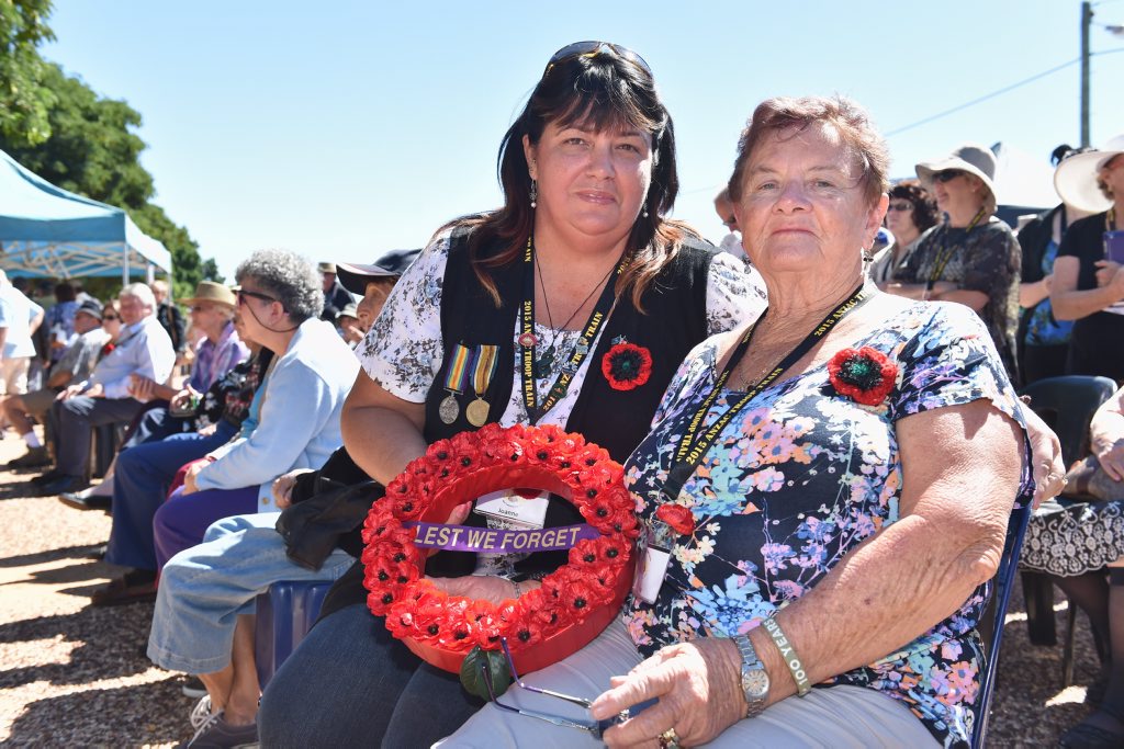 Image for sale: 2015 Anzac Troop Train Re-Enactment - Longreach to Emerald. (R) Rose Hawkins and Joanne Connop lay a wreath at Alpha in memory of Pte Reginald Hawkins who enlisted at Jericho. Photo: Alistair Brightman / Fraser Coast Chronicle