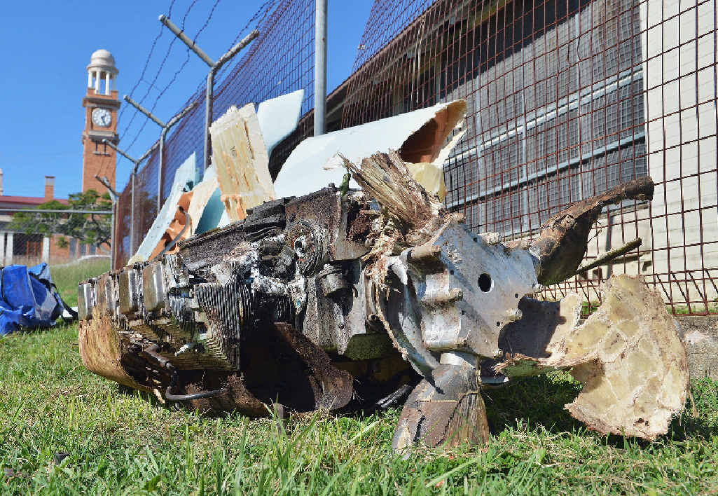 CRASH REMNANT: The engine recovered from Saturday’s Woolooga air crash scene awaits forensic examination CRASH REMNANT: The engine recovered from Saturday’s Woolooga air crash scene awaits forensic examination