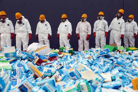 The counterfeiting of medicines and pharmaceutical goods is on the rise, with China leading the way - here, health workers prepare to destroy packages of fake medicines in Beijing The counterfeiting of medicines and pharmaceutical goods is on the rise, with China leading the way - here, health workers prepare to destroy packages of fake medicines in Beijing