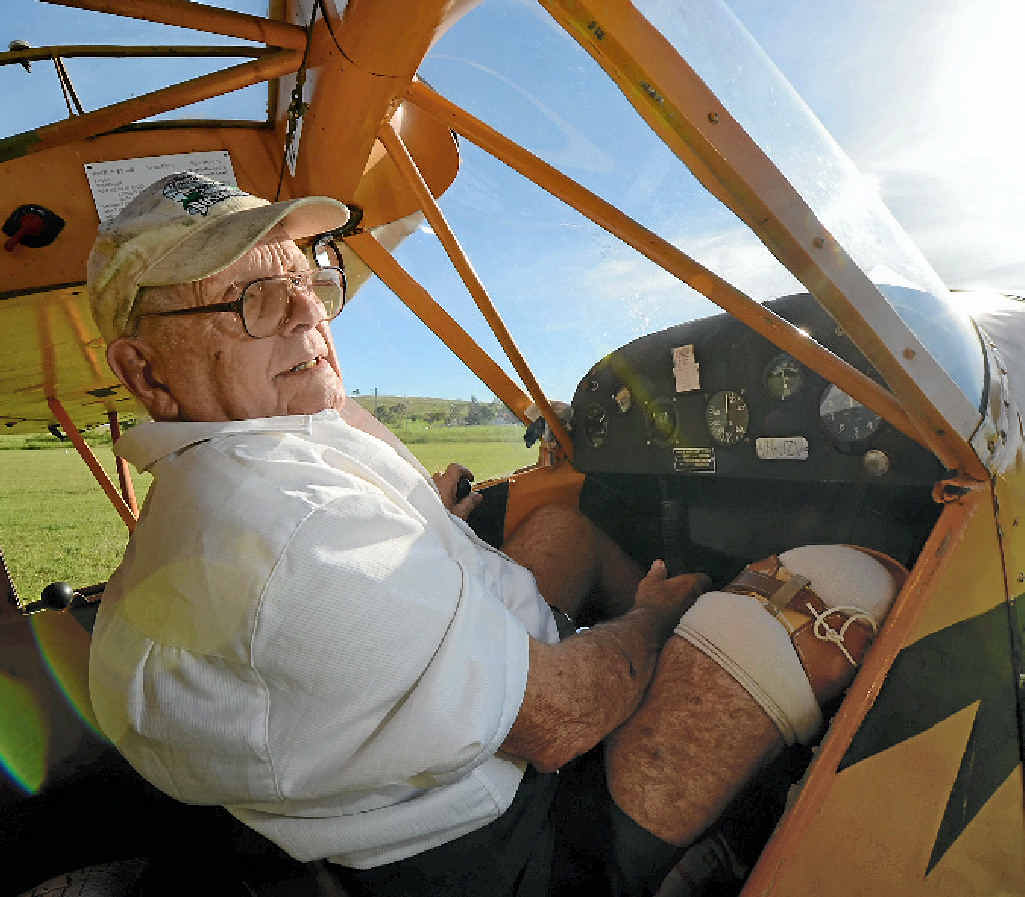 READY FOR TAKE-OFF: Emu Park’s Ivan Unwin, at the controls of his Piper Cub two-seater, will tomorrow mark 70 years of flying. READY FOR TAKE-OFF: Emu Park’s Ivan Unwin, at the controls of his Piper Cub two-seater, will tomorrow mark 70 years of flying.
