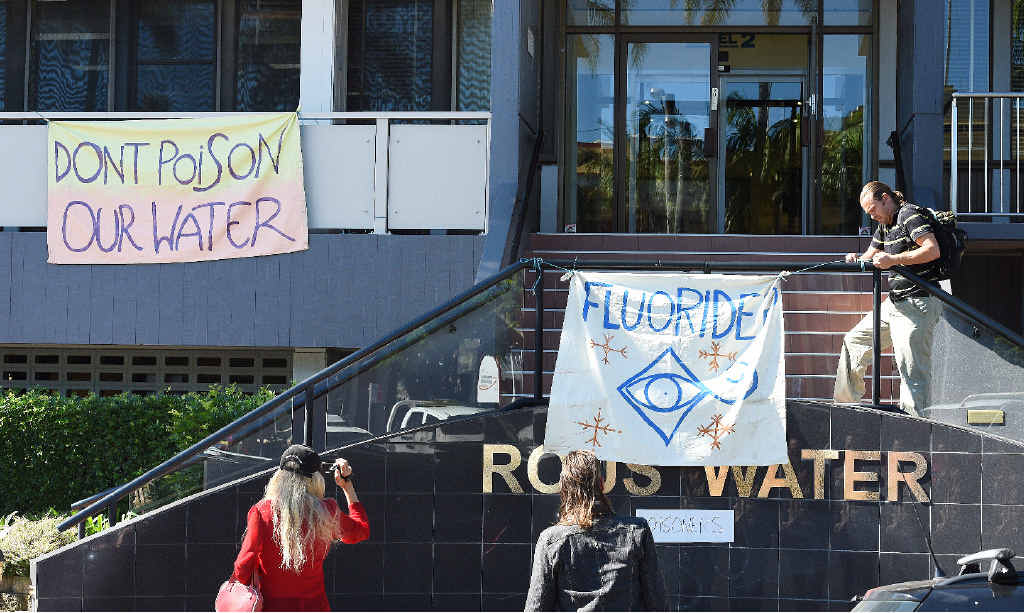 Protestors place signs up around the Rouse Water building in Lismore. Photo Marc Stapelberg / The Northern Star Protestors place signs up around the Rouse Water building in Lismore. Photo Marc Stapelberg / The Northern Star
