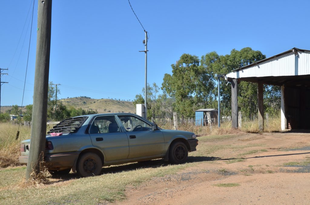 CRASH: A woman was trapped for about five seconds between car and power pole as she tried to stop it rolling backwards. CRASH: A woman was trapped for about five seconds between car and power pole as she tried to stop it rolling backwards.