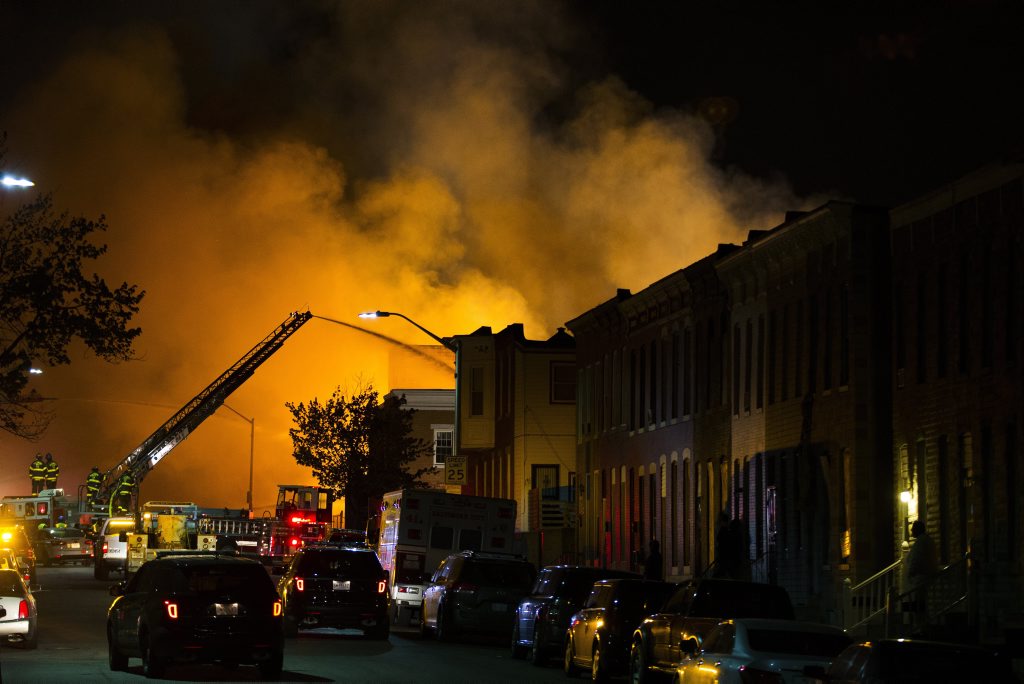 Firefighters battle a blaze, Monday, April 27, 2015, after rioters plunged part of Baltimore into chaos, torching a pharmacy, setting police cars ablaze and throwing bricks at officers. (AP Photo/Evan Vucci) Firefighters battle a blaze, Monday, April 27, 2015, after rioters plunged part of Baltimore into chaos, torching a pharmacy, setting police cars ablaze and throwing bricks at officers. (AP Photo/Evan Vucci)