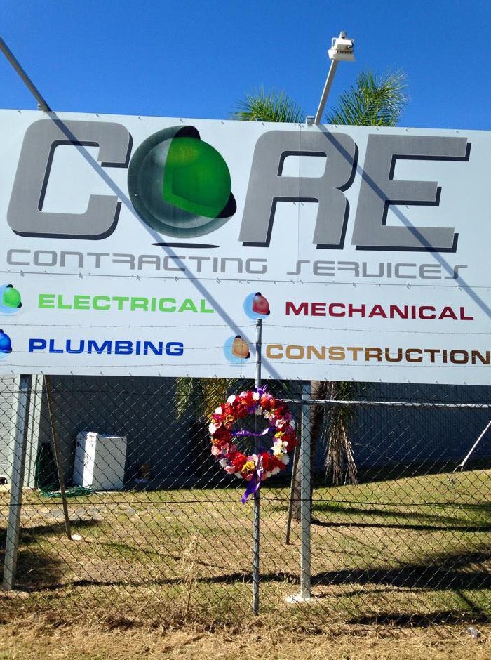 Flowers placed along the fence at Core Contracting Services. Flowers placed along the fence at Core Contracting Services.
