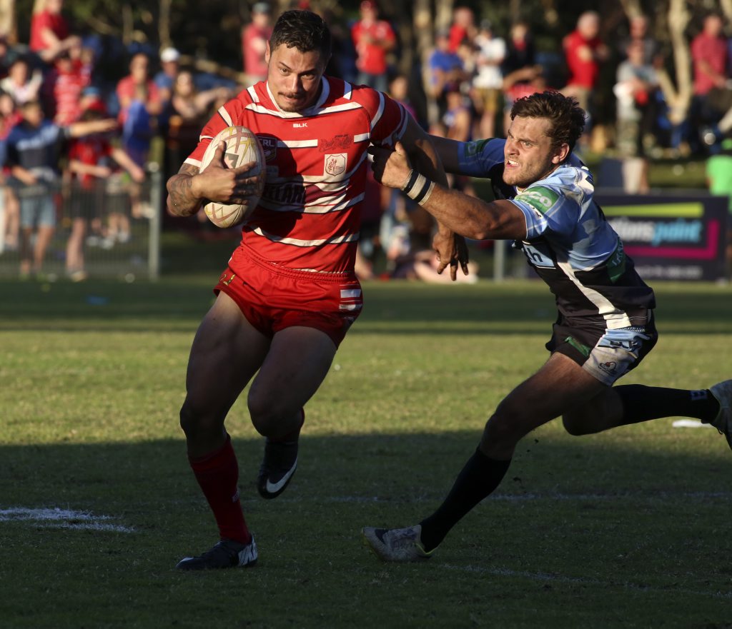 Byron's Scott Stapleton making a run down the line while Michael Thomas tries to stop him during the Ballina v Byron Bay NRRRL Grand final. September 14, 2014. Byron's Scott Stapleton making a run down the line while Michael Thomas tries to stop him during the Ballina v Byron Bay NRRRL Grand final. September 14, 2014.