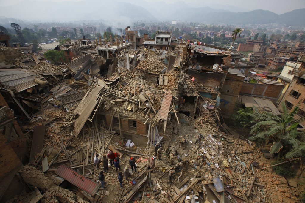 Rescue workers remove debris as they search for victims of earthquake in Bhaktapur near Kathmandu, Nepal, Sunday, April 26, 2015. A strong magnitude earthquake shook Nepal's capital and the densely populated Kathmandu Valley before noon Saturday, causing extensive damage with toppled walls and collapsed buildings, officials said. (AP Photo/Niranjan Shrestha) Rescue workers remove debris as they search for victims of earthquake in Bhaktapur near Kathmandu, Nepal, Sunday, April 26, 2015. A strong magnitude earthquake shook Nepal's capital and the densely populated Kathmandu Valley before noon Saturday, causing extensive damage with toppled walls and collapsed buildings, officials said. (AP Photo/Niranjan Shrestha)