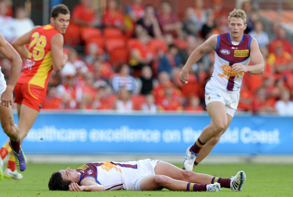 Tom Rockliff of the Lions is knocked out after colliding with Steven May of the Suns during the round five AFL match between the Gold Coast Suns and the Brisbane Lions at Metricon Stadium on May 2, 2015 in Gold Coast, Australia. Tom Rockliff of the Lions is knocked out after colliding with Steven May of the Suns during the round five AFL match between the Gold Coast Suns and the Brisbane Lions at Metricon Stadium on May 2, 2015 in Gold Coast, Australia.