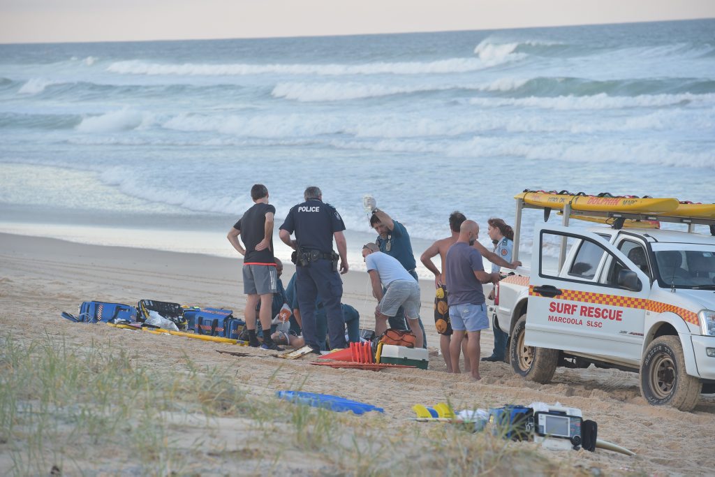 Paramedics perform CPR on a man who was pulled from the surf unconscious at Marcoola Beach. He was pronounced dead on the scene. Photo: Brett Wortman / Sunshine Coast Daily Paramedics perform CPR on a man who was pulled from the surf unconscious at Marcoola Beach. He was pronounced dead on the scene. Photo: Brett Wortman / Sunshine Coast Daily