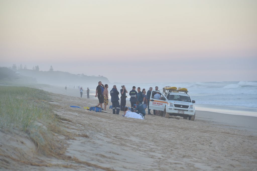 Paramedics perform CPR on a man who was pulled from the surf unconscious at Marcoola Beach. He was pronounced dead on the scene. Photo: Brett Wortman / Sunshine Coast Daily Paramedics perform CPR on a man who was pulled from the surf unconscious at Marcoola Beach. He was pronounced dead on the scene. Photo: Brett Wortman / Sunshine Coast Daily