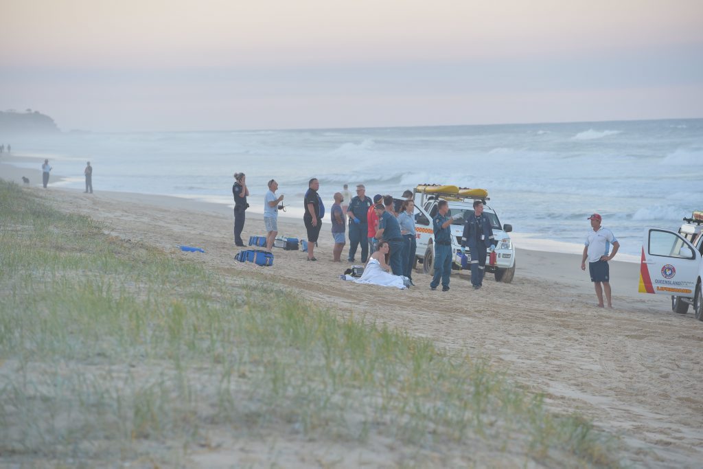 Paramedics perform CPR on a man who was pulled from the surf unconscious at Marcoola Beach. He was pronounced dead on the scene. Photo: Brett Wortman / Sunshine Coast Daily Paramedics perform CPR on a man who was pulled from the surf unconscious at Marcoola Beach. He was pronounced dead on the scene. Photo: Brett Wortman / Sunshine Coast Daily