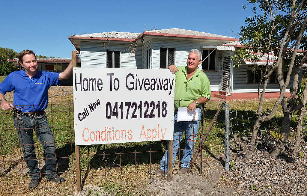 Building Supervisor Philip Whitmore left and Builder Stephen Challen with the home they are giving away. Building Supervisor Philip Whitmore left and Builder Stephen Challen with the home they are giving away.