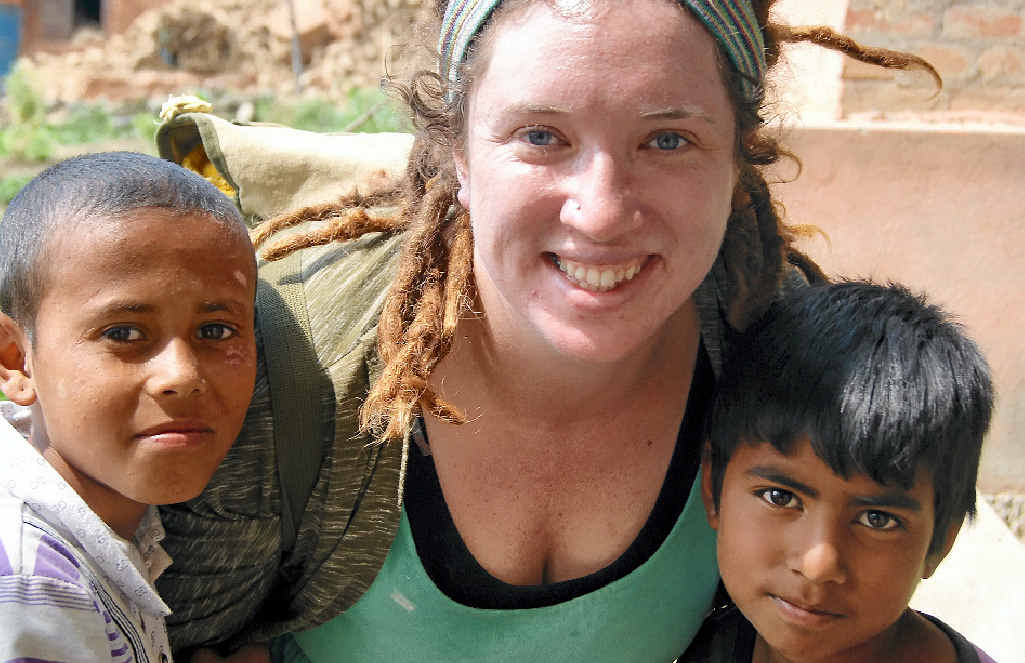 HELPING HAND: Ally Jensen with Nepali children Bishal (left) and Sundar who showed Ally around their village where 35 houses were destroyed. HELPING HAND: Ally Jensen with Nepali children Bishal (left) and Sundar who showed Ally around their village where 35 houses were destroyed.