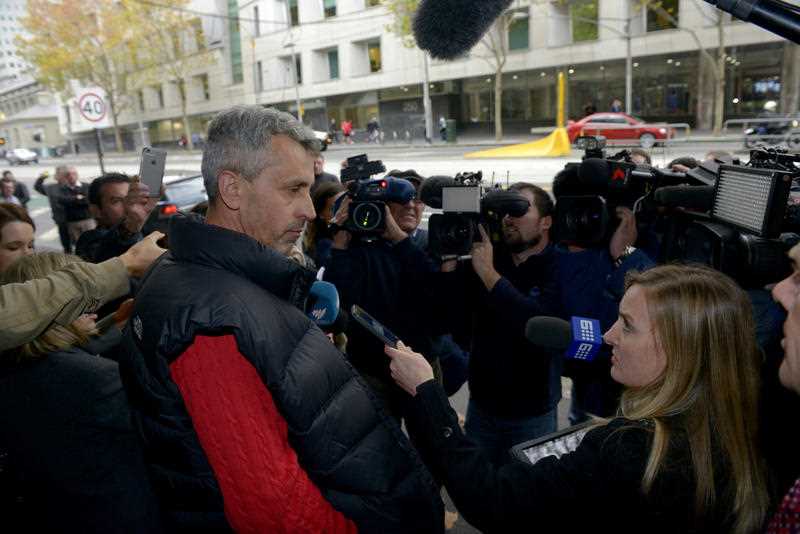 Vehid Cauesvic (left), the father of Harun Causevic, one of two teenagers accused of conspiracy to commit a terrorist act, is met by the media outside the Melbourne Magistrates Court after his son's bail application was refused in Melbourne, Friday, May 8, 2015. Vehid Cauesvic (left), the father of Harun Causevic, one of two teenagers accused of conspiracy to commit a terrorist act, is met by the media outside the Melbourne Magistrates Court after his son's bail application was refused in Melbourne, Friday, May 8, 2015.