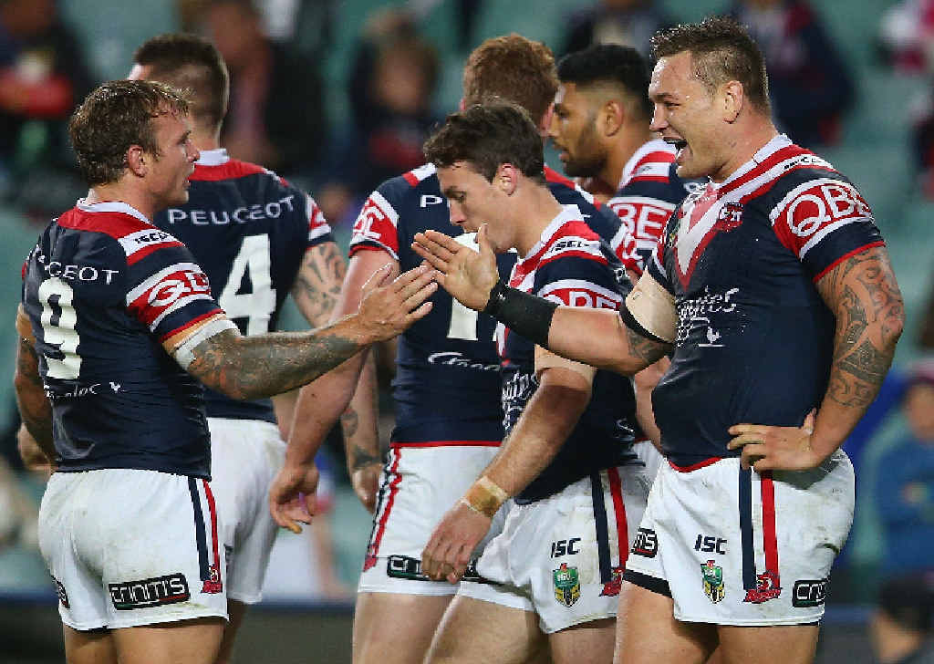 ROOSTERS CROW: Jake Friend and Jared Waerea-Hargreaves share the joy after a try at Sydney’s Allianz Stadium on Friday night. ROOSTERS CROW: Jake Friend and Jared Waerea-Hargreaves share the joy after a try at Sydney’s Allianz Stadium on Friday night.