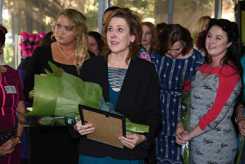 Leanne Robson from Queensland, (centre), looks on after being presented the Barnardos Mother of the Year 2015 award, by Prime Minister Tony Abbott, at Kirribilli House, in Sydney, Sunday, May 10, 2015. Leanne Robson from Queensland, (centre), looks on after being presented the Barnardos Mother of the Year 2015 award, by Prime Minister Tony Abbott, at Kirribilli House, in Sydney, Sunday, May 10, 2015.