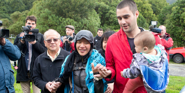 Missing runner Susan O'Brien is reunited with her family - father Andrew Khoo, mother Maggie Khoo and husband Daniel O'Brien - after being found in the Rimutaka Forest Park. Photo / Mark Mitchell Missing runner Susan O'Brien is reunited with her family - father Andrew Khoo, mother Maggie Khoo and husband Daniel O'Brien - after being found in the Rimutaka Forest Park. Photo / Mark Mitchell
