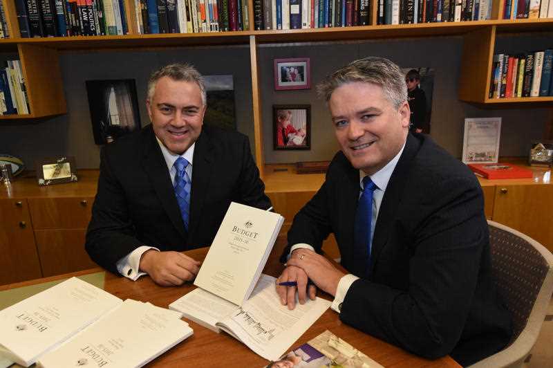 Federal Treasurer Joe Hockey (L) and Minister for Finance Mathias Cormann at a photo opportunity before the delivery of the Budget later today at Parliament House in Canberra, Tuesday, May 12, 2015. Federal Treasurer Joe Hockey (L) and Minister for Finance Mathias Cormann at a photo opportunity before the delivery of the Budget later today at Parliament House in Canberra, Tuesday, May 12, 2015.