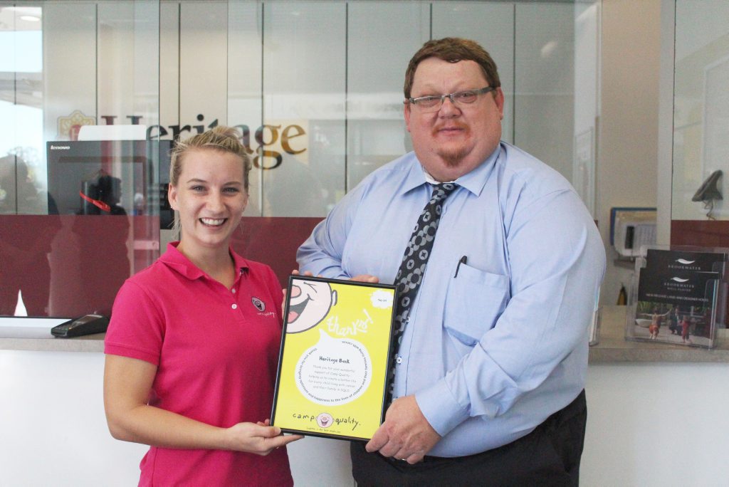 Camp Quality Fundraising Coordinator Emma Vekar and Heritage Bank Regional Sales and Service Manager (Western Region) Ron Franks Camp Quality Fundraising Coordinator Emma Vekar and Heritage Bank Regional Sales and Service Manager (Western Region) Ron Franks
