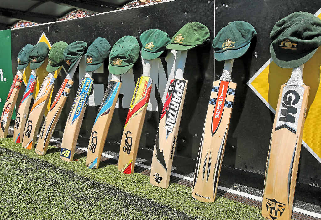 HUGHES HONOUR: The bats and caps of the Australian cricket team left by the field in a tribute to the late Phillip Hughes. HUGHES HONOUR: The bats and caps of the Australian cricket team left by the field in a tribute to the late Phillip Hughes.