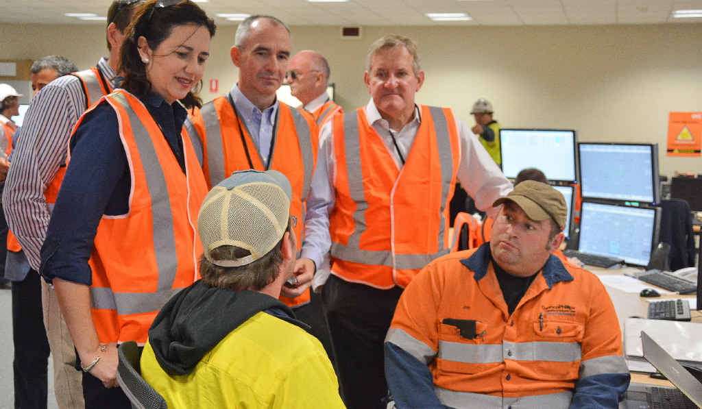 ON THE GROUND: Premier Annastacia Palaszczuk, QGC managing director Mitch Ingram and Federal Industry Minister Ian Macfarlane in the operations room talking to ConocoPhillips’s Will James and Jon Boone. ON THE GROUND: Premier Annastacia Palaszczuk, QGC managing director Mitch Ingram and Federal Industry Minister Ian Macfarlane in the operations room talking to ConocoPhillips’s Will James and Jon Boone.