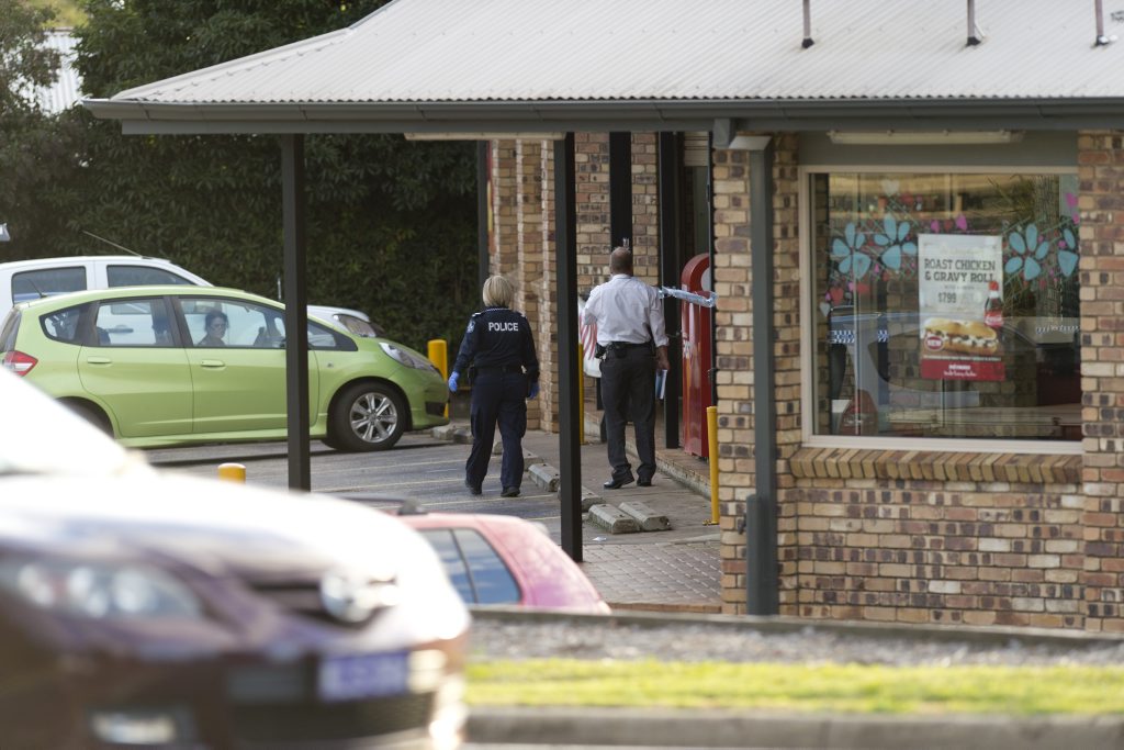 Police investigate an armed robbery at the Harlaxton Foodworks. Police investigate an armed robbery at the Harlaxton Foodworks.